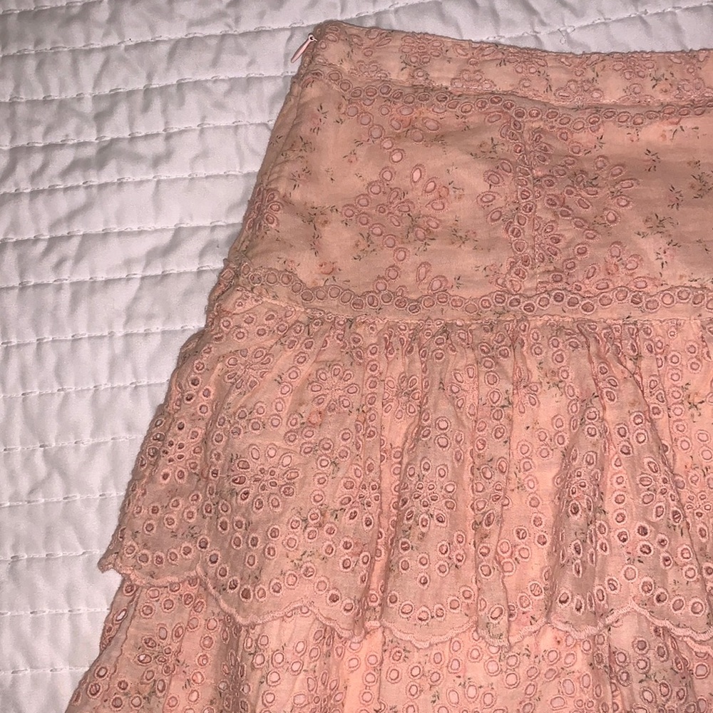 Love Shack Fancy pink skirt with floral print lace skirt